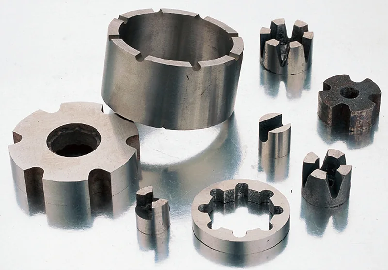 Machined cast and sintered Alnico magnet components with slots and custom profiles